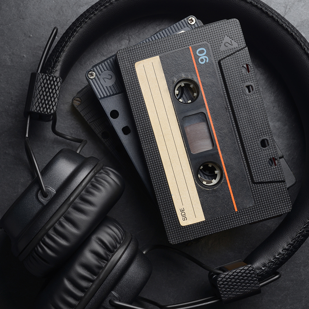 black ear headphones audio tape compact cassettesac2