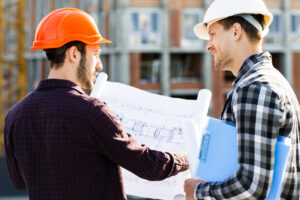 close up back view engineer architect supervising construction