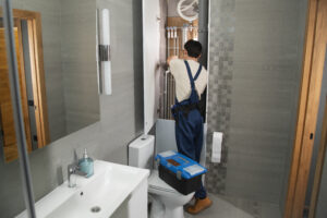 male plumber working fix problems client s house