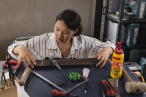 medium shot woman working with wood