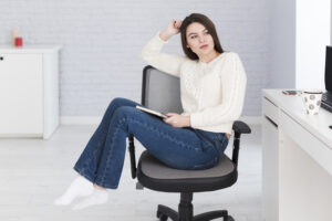 thoughtful woman with notepad office