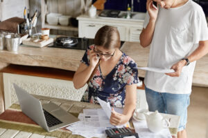 couple managing budget together kitchen