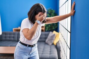 young woman suffering dizzy home