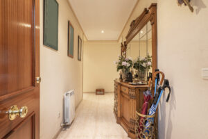 entrance hall house with sideboard with turned wooden mirror full umbrella stand