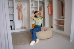 full shot woman using dry shampoo home