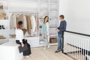 long shot couple looking through dressing