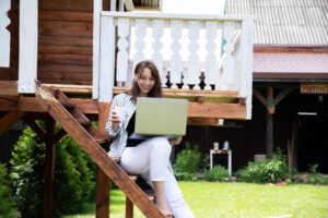 smiling young woman sitting wooden chair