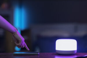 side view hand with smartphone smart light